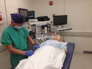 Standardized Patient getting ready to play role as scrub nurse
